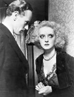 Beta Deivisa un Leslijs Hovards (Leslie Howard) filmā “Cilvēcisko kaislību jūgs”. 1934. gads.